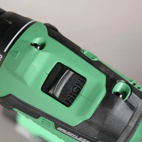 Close-up of green Cordless 18V Drill And Impact Driver Combo Kit With Sub Compact Design showing high-speed brushless motor switch.