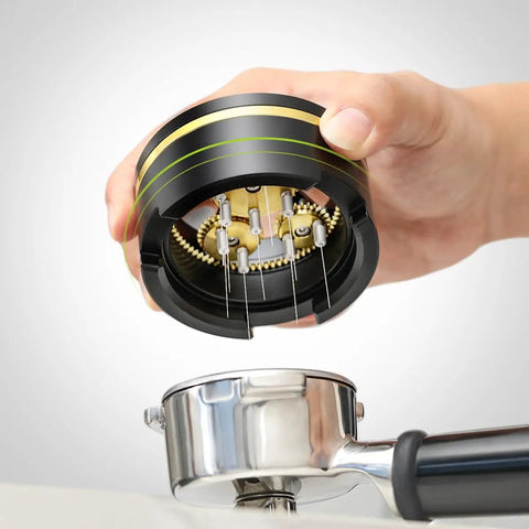 Hand holding Top Shelf 54Mm Spirographic WDT Tool Espresso Coffee Distribution above a portafilter with fine needles.