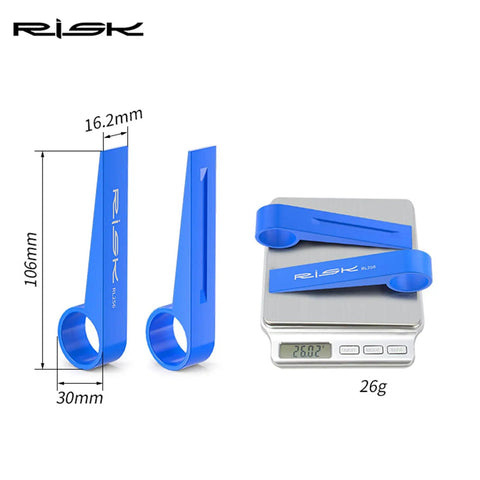 Bike Disc Brake Pad Spreader And Piston Reset Tool for Hydraulic Calipers, single-sided reset, blue, on digital scale showing 26g