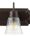 Transitional Five Light Vanity Fixture in Oiled Bronze with Clear and Seeded Glass Damp Rated Bathroom Lighting close-up