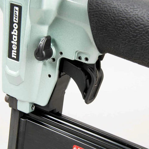 Close-up of trigger mechanism on 23 Gauge Pin Nailer Kit For Fine Trim And Molding Pneumatic Nailer With Built In Silencer Depth Adjustable For Half To Two Inch Pins Includes Safety Glasses Case And Oil NP50A