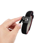 Hand holding Anti Static Wrist Strap Eleven Inch Grounding Bracelet With Alligator Clip And Extendable Cable No Fuss Adjustable Fits Wrists Six To Eight Point Five Inches Red ESD Safe For PC Repair And Electronics Assembly showcasing alligator clip.