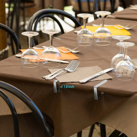 12 Pack Picnic Tablecloth Clips For Outdoor Tables, Heavy Duty Metal Cloth Clamps shown securing tablecloth in outdoor setting