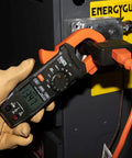 Electrician using Digital Clamp Meter With Auto-Ranging 400 Amp AC, Measures AC/DC Voltage, Resistance And Continuity on job site