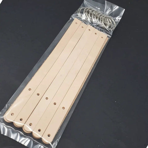 Ten Pack Of One Half Inch Natural Vegetable Tanned Leather Keychain Blanks Ready For Custom Stamping And Tooling, including straps and rings.