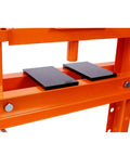 Close-up of Heavy Duty H Frame Shop Press With True 12 Ton Hydraulic Power showing black plate supports on orange frame.