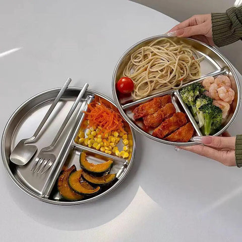 Hands holding Portion Control Plates For Grownups, Stainless Steel Divided Dinner Plates For Weight Loss And Diabetic Diets, Unbreakable 9 Inch Round Metal Dish for Kitchen, Camping And Picnic, with food in three sections.
