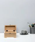 Wooden box with Black Iron Wardrobe Door Hinge Set, 20 Pieces, Six Hole Mounting, Three Fold Straight Corner Design on a desk.