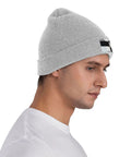 Dope Black And White Grid Pattern Knit Beanie Hat For Winter Super Cozy Acrylic Skully Cap That Keeps You Toasty In Frosty Days Lightweight Yet Insulated Everyday Wear For Street Style Fits on man's head in profile.