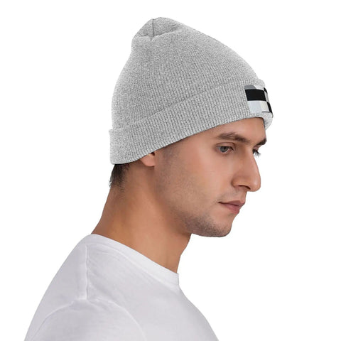 Dope Black And White Grid Pattern Knit Beanie Hat For Winter Super Cozy Acrylic Skully Cap That Keeps You Toasty In Frosty Days Lightweight Yet Insulated Everyday Wear For Street Style Fits on man's head in profile.