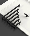 10 Pack 3.75 Inch Matte Black Knurled Cabinet Pull Handles for kitchen cabinets, shown on a white board, illustrating size and style.