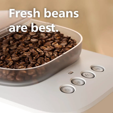 Bean To Cup Espresso Maker Featuring A Built In Grinder And Auto Milk Frother Delivering Thick Microfoam With A Rock Solid 16 Bar Pump showing fresh coffee beans in the grinder.