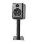 Black speaker on Rising Desktop Speaker Stands for Small to Medium Bookshelf Speakers and 2 to 4 Inch Studio Monitors, 8.3 Inch Tall