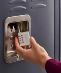Hand using Set Your Own Combination Padlock 643D 1 Pack Indoor Locker and Cabinet Lock Silver Durable Steel Security for School Gym Office
