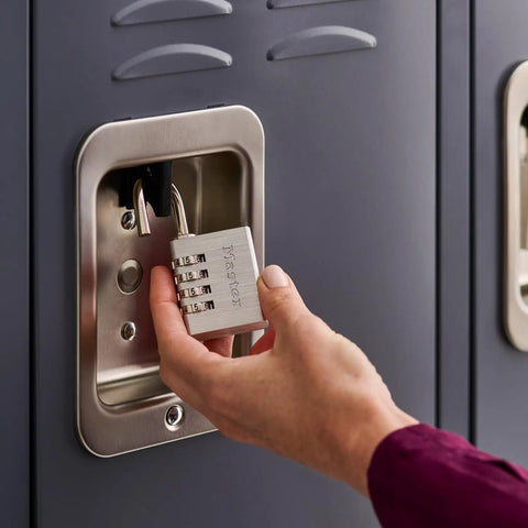 Hand using Set Your Own Combination Padlock 643D 1 Pack Indoor Locker and Cabinet Lock Silver Durable Steel Security for School Gym Office