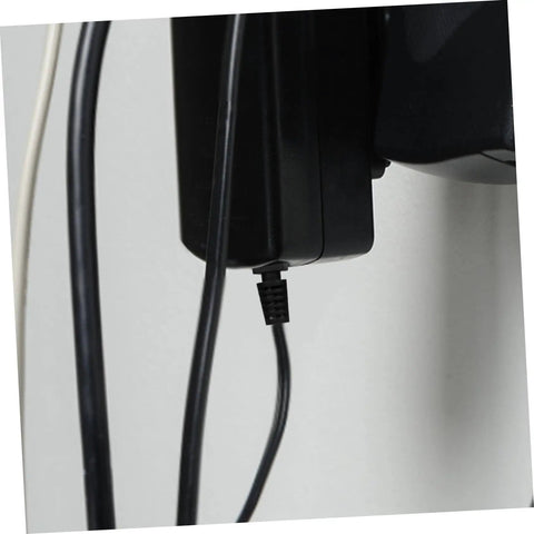 Cable connected to a device using a 100 Pieces Cable Glands Protector Kit Strain Relief Cord Grips For Electrical Wires, Black.