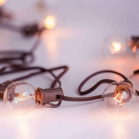 G40 Replacement Light Bulbs 120V 5W Clear Globe Bulbs For Indoor And Outdoor Vibes Patio String Lights, glowing warmly on string.