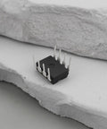 10Pcs ICL7660 ICL7660S ICL7660SCPAZ CMOS Voltage Converter IC PDIP8 on stone background