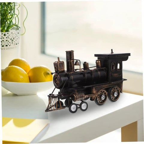 Vintage Steam Locomotive Model Sculpture for Desk Decor and Living Room on white table next to fruit bowl