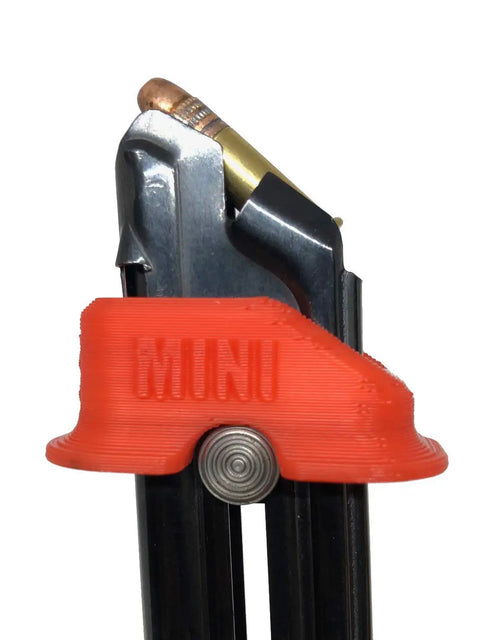Close-up of Mini Mag Speed Loader Fits Ruger Mark I II III IV 22 45, Smith And Wesson Victory, Browning Buck Mark 22LR with red ergonomic design