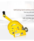 Yellow hand crank winch with self locking brake, durable steel construction, for home improvement and cargo lifting up to 2600 lbs