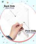 Printable Heat Transfer Paper For Light Fabrics 8.5 By 11 Inches Pack Of 20 Sheets, hand holding sheet showing back and print sides