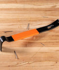 Heavy Duty 15 Inch Pry Bar Crowbar With Curved Claw And Beefy Nail Slots Forged Carbon Steel Construction For Prying Scraping Lifting And Pulling Comfortable Grip Tool For Pros And DIY Projects on wooden surface with nails