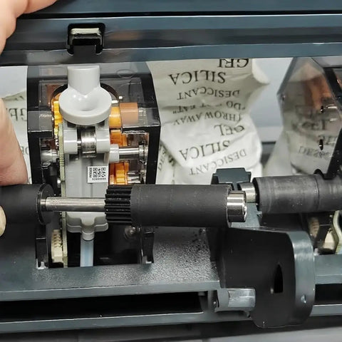 Quick Swap Active Support Shaft Assembly Replacement To Bust Jammed Spool Rotations Core Repair Kit For Automated Material System close-up of drive mechanism.