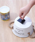 Heavy Duty Black PVC Repair Sealant Tape Waterproofs Leaks And Cracks Instantly for use on a white bucket with rope handles.