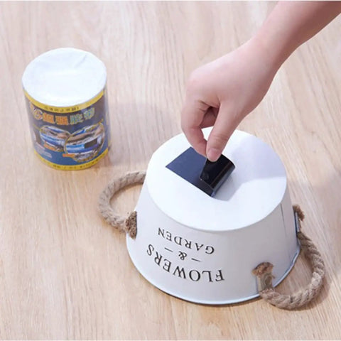 Heavy Duty Black PVC Repair Sealant Tape Waterproofs Leaks And Cracks Instantly for use on a white bucket with rope handles.