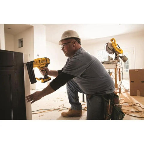 Worker using Battery Powered Cordless 18 Gauge Brad Nailer 20V Max XR with Brushless Motor for precise nail placement.