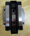 Top view of R165129310 Ball Carriage Rexroth Kugelwagen for Linear Guide Rails with metal and black sections
