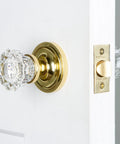 Classic Rosette With Crystal Door Knob For Large Doors, Vintage Vibe Doorknob Set on white door, showing elegant brass rosette and crystal knob