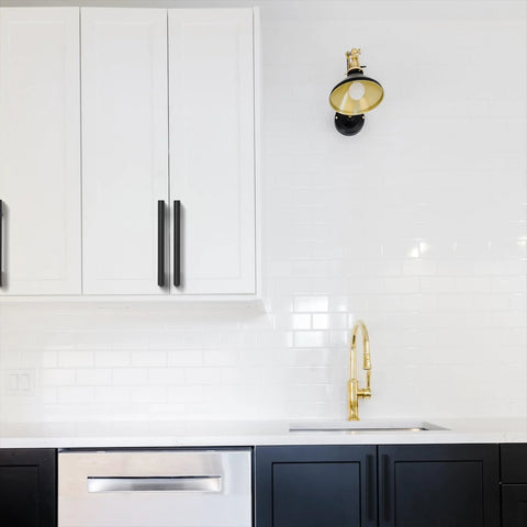 Installed five inch black and gold knurled cabinet pulls set of ten heavy duty drawer handles on white kitchen cabinets.