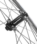 Hub detail of Carbon Disc Brake Wheelset 700c 50mm By 25mm Tubeless Ready, showing spokes and paint-free finish.
