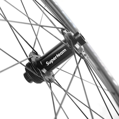 Hub detail of Carbon Disc Brake Wheelset 700c 50mm By 25mm Tubeless Ready, showing spokes and paint-free finish.