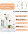 Black And Gold Globe Wall Sconce Mid Century Modern One Light Fixture details next to bathroom mirror and plant