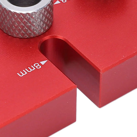 Close-up of the Top Shelf Wood Doweling Jig Drill Kit with red aluminum base and adjustable 8mm bushing for precise joinery.