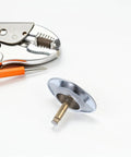 Copper Bathtub Drain Stopper with Rotary One Press Sealing next to installation tools on a white background.