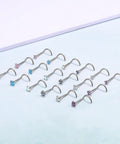 G23 Nano Pure Titanium Nose Studs Pack of 6 Has 18G and 20G with colorful CZ ends on a soft blue background.