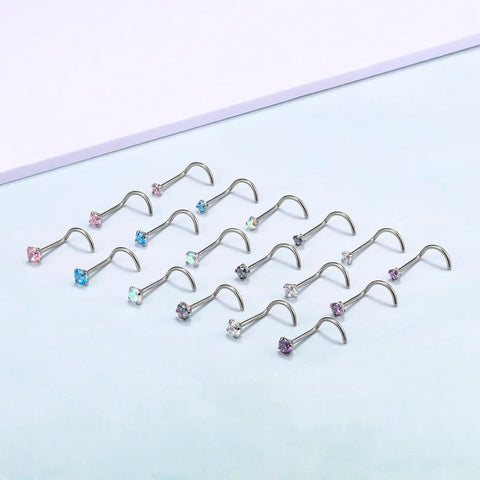 G23 Nano Pure Titanium Nose Studs Pack of 6 Has 18G and 20G with colorful CZ ends on a soft blue background.