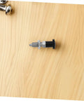 Slick Reset Spring Plunger With Steel Indexing Knob And Fine Thread Cut For Automotive Factories and Precision Gear Tuning, sitting on wood.