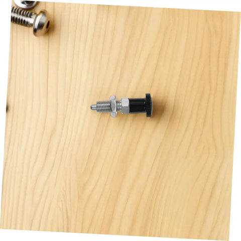 Slick Reset Spring Plunger With Steel Indexing Knob And Fine Thread Cut For Automotive Factories and Precision Gear Tuning, sitting on wood.