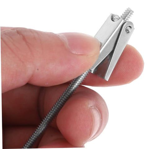 Close-up of 15-Piece Beefed-Up Metal Toggle Bolt Kit With Wing Nuts For Drywall Anchors in hand, showing details of the metal structure.