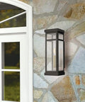 Hopewell Black 1 Light Outdoor Wall Lantern with Transitional Design and Timeless Traditional Charm mounted on stone wall