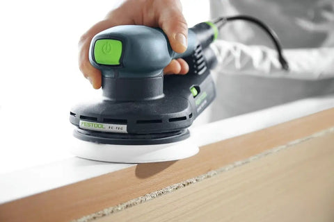 Heavy Duty 5 Inch Random Orbit Sander Featuring A Brushless Motor And Ergonomic Grip in use on wood edge.