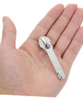 Hand holding a metal slider from 4 Pack Zipper Repair Kit For Luggage And Gear, Universal Zipper Pull Replacements For Jackets and more