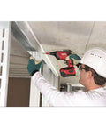 Person using 18V Cordless Drywall Screwdriver With Box, Beast 4500 RPM Performance on ceiling panel
