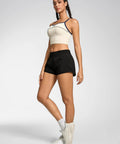Model wearing Womens 2.5 Inch Quick Dry Gym Shorts With High Waist And Zip Pockets Built In Liner Breathable Mesh Panels Black XS.