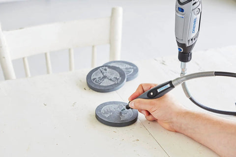 User carving a design on a slate disc with Top Tier Variable Speed Rotary Tool Kit With Hella Steady Flex Shaft And Badass Accessory Bundle.